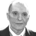 Retrato a preto e branco de um homem de fato e gravata, fotografado de frente. Não há texto visível que permita identificá-lo.