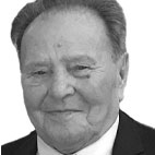 Retrato a preto e branco de um homem mais velho, de fato e gravata, sobre fundo branco. Não há texto visível que permita identificá-lo.