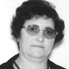 Retrato a preto e branco de uma pessoa com cabelo curto e óculos, sobre um fundo claro. Não há texto visível que permita identificá-la.
