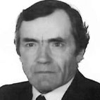 Fotografia a preto e branco, em formato de retrato, de um homem de fato e gravata. Não há texto visível que permita identificá-lo.